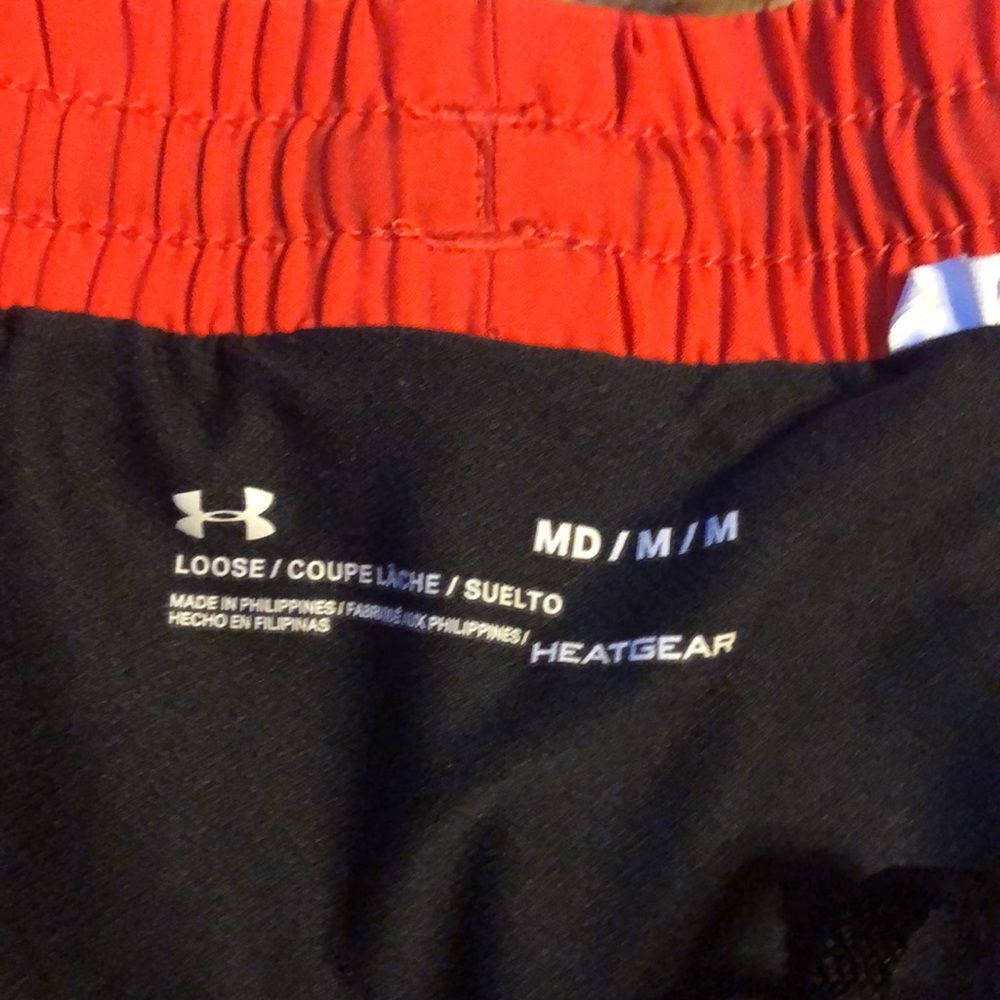 Under Armour athletic running shorts. Redish orange color. - Picture 3 of 4